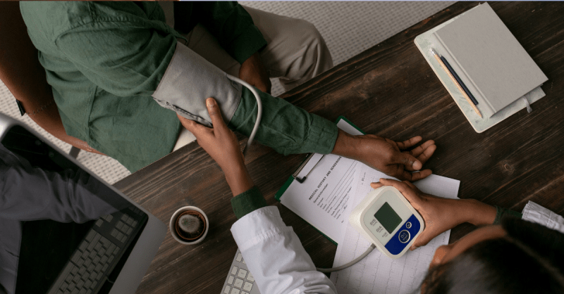 Clinician consulting patient